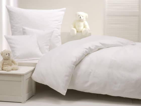 Comment laver parfaitement des draps et taies d’oreiller tachés par du sébum ou de la transpiration ?